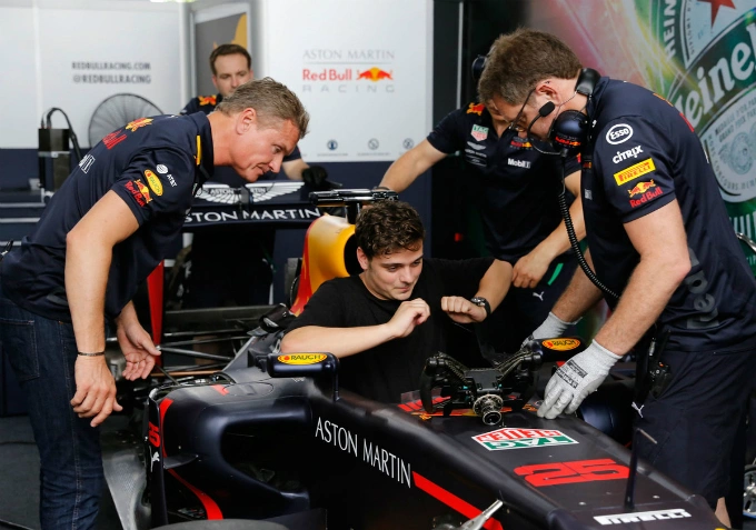 Dutch DJ Martin Garrix is set up before rolling out the F1 racing car on the street of Saigon.