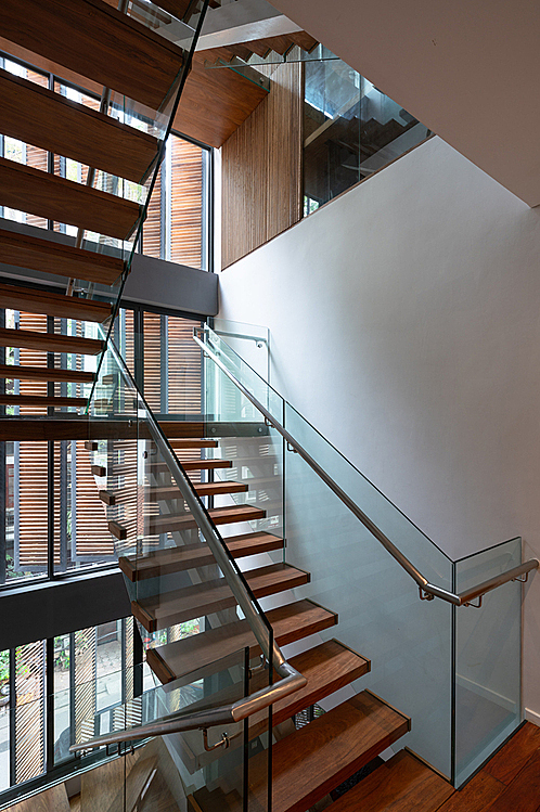 Starcase is always filled with natural light, thanks to the glass windows with wooden shutters.