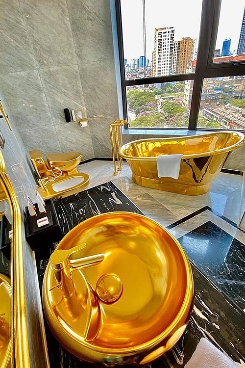 Glittering bathroom with a city view.