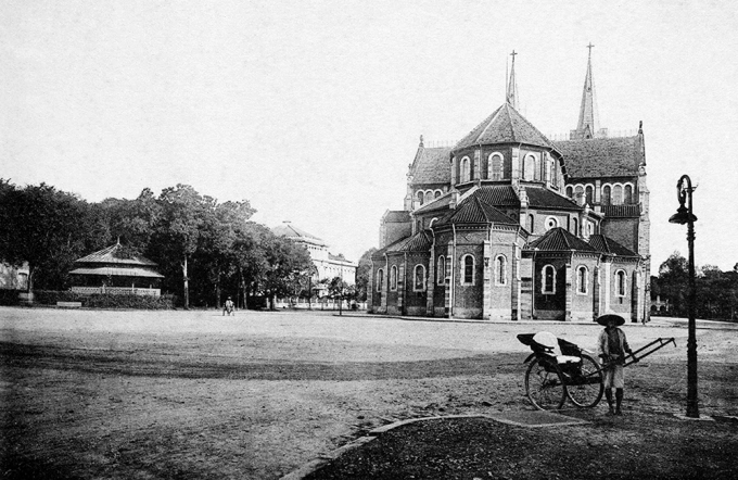 A view of the old Saigon Notre Dame Cathedral. The cathedral did not have two bell towers when it inaugurated in 1880. They were later added in 1985, using a total of six large bronze bells, with two crosses on top of the roofs to peak at 60.5 m above ground.