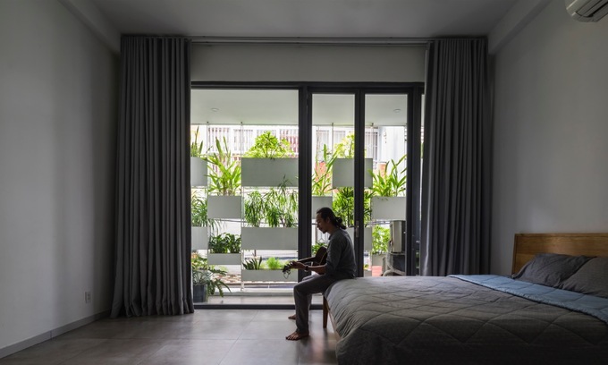 Minimalist bedroom with a green view.