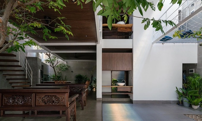 From a solemn worship area for adults to the childrens felling net above the parking lot, the house is meant to be a comfortable home for all of its owners.