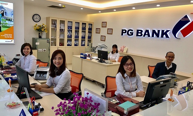 Bank tellers working in PGBank in Hanoi. Photo courtesy of PGBank.