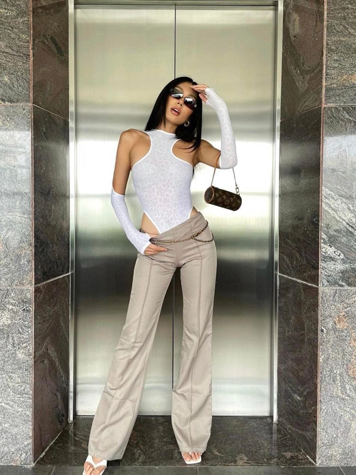 The cutout shirt helps model Thao Nhi Le show off her tanned skin.