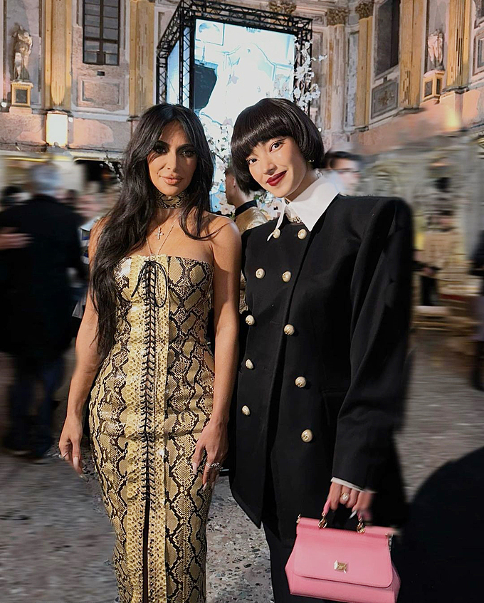 At a D&G event on Saturday, Chau Bui (right) wore a padded shoulder jacket with a see-through skirt, platform shoes and a pink handbag. Kim stayed loyal to her signature style, wearing a tight snakeskin dress that adorned her curves.It was Chau’s second time meeting Kim, after another D&G event in September 2022. Chau said she was impressed by Kims beauty and talent.