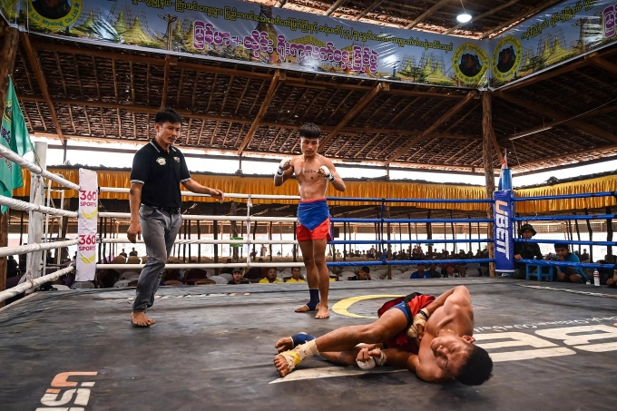 As well as fists, feet, knees, elbows and even the head can also be used to strike an opponent in Lethwei. Photo by AFP