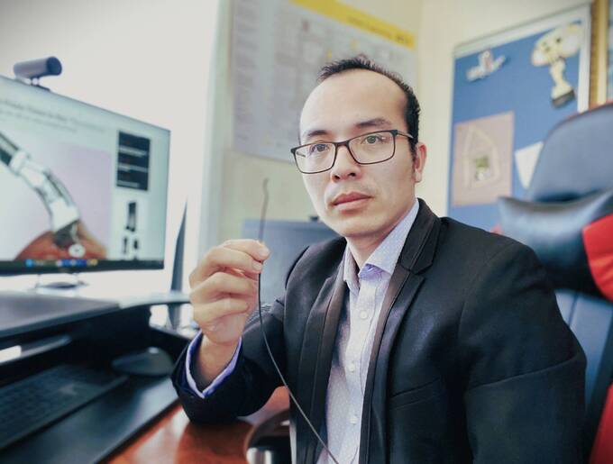Dr. Do Thanh Nho holds the soft robotic catheter that he invented with his team. Photo courtesy of Dr. Do Thanh Nho