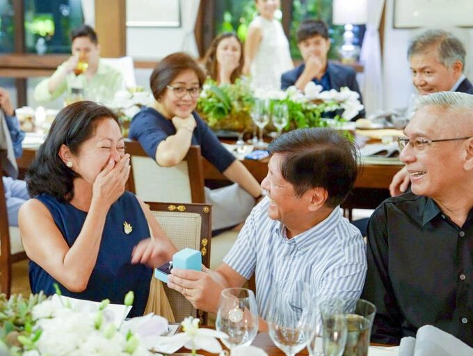First Lady Liza expresses her happiness when her husband, Marcos, kneels down and proposes to her. Photo by Marcos Bongbong Facebook page