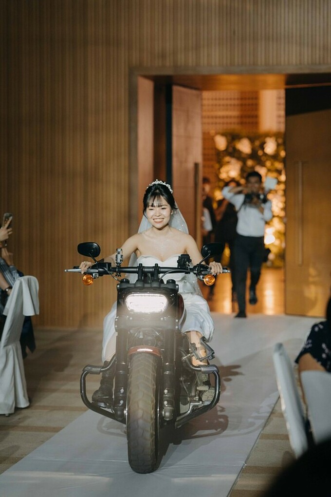 Dinh Ngoc Bao Tran rides a motorcycle to the aisle in her wedding. Photo courtesy of Dinh Ngoc Bao Tran