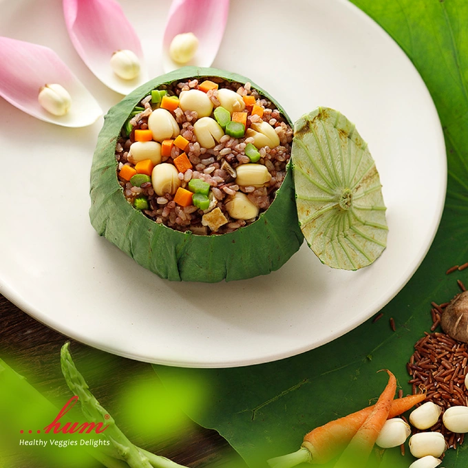 Lotus leaf wraps around a mixture of brown rice, lotus seeds, tofu, carrots and green beans, give a fragrant aroma. Photo courtesy of Hum