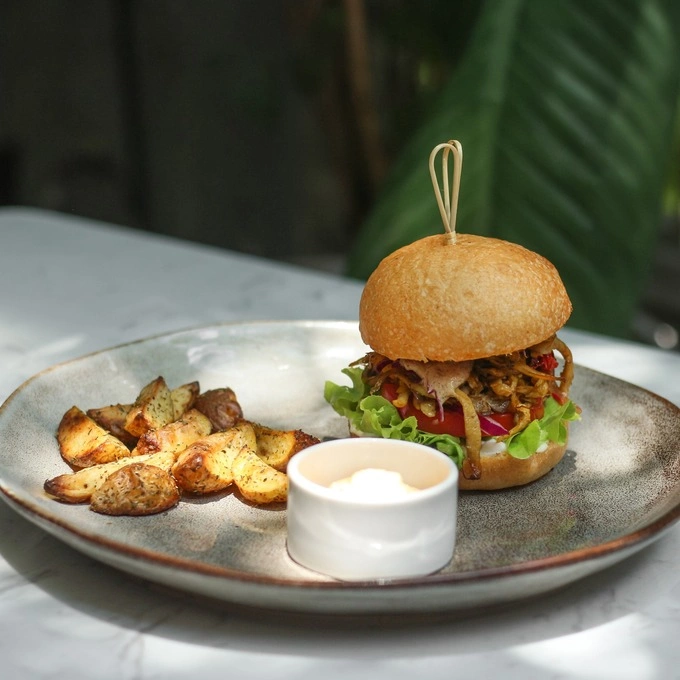 The burger baked mushroom is served with crispy fried potatoes and homemade vegan mayonnaise. Photo courtesy of Zeroism - Vegan Cafe & Bakery