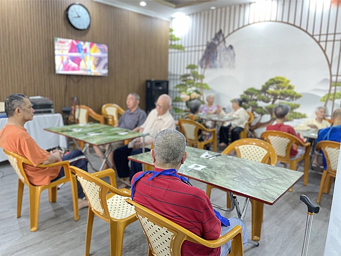 Elderly people at a nursing home on To Ngoc Van Street, Hanois Tay Ho District before breakfast, May 6, 2023. Photo by VnExpress/ Phan Duong