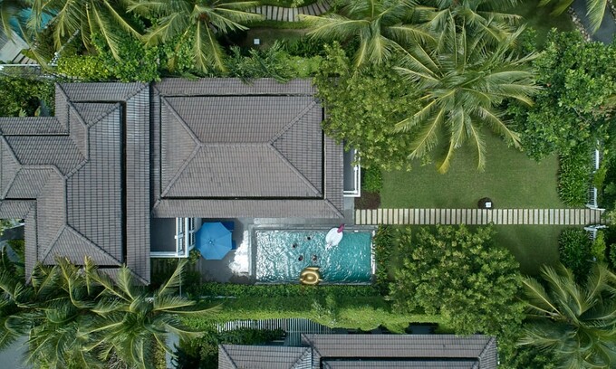 A villa at Premier Village Danang Resort in Da Nang City is surrounded by green trees. Photo courtesy of the resort