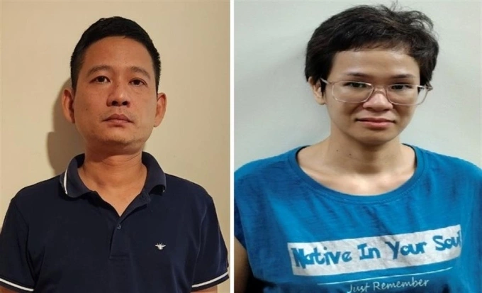 Phu Quy chairman Le Xuan Tung (L) and Le Thuy Quynh at the police station. Photo courtesy of the Ministry of Public Security