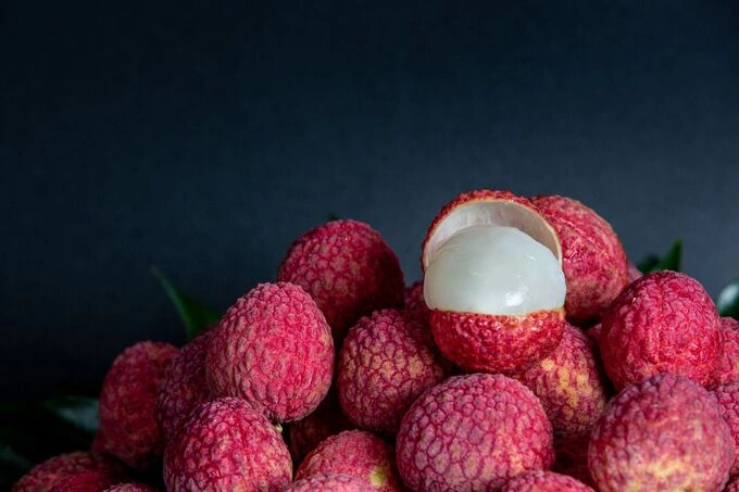 When lychees ripen, their shells turn red. Photo illustration by Freepik