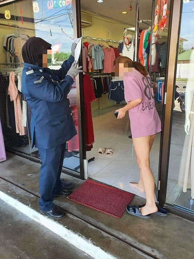 A shopkeeper in the Malaysian town of Kota Bharu is fined for wearing shorts. Photo from Ooi Beng Cheang’s Twitter