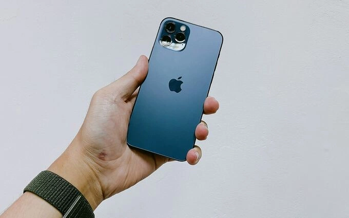 Muhammad Hafiz Abdul Hamid, 30, bought an iPhone with the coins he saved over seven years. Photo illustration by Unsplash
