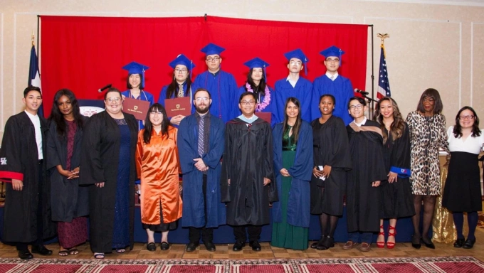 Van Tan Hoang Vy (C) and other teachers take photos with the first six VHA students to graduate from high school in 2022. Photo by Vy