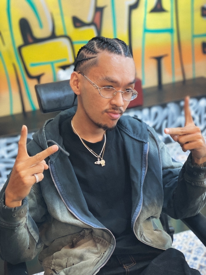 Rapper Minh Lai in full-head cornrow braids, which reportedly took two and a half hours to complete. Photo courtesy of Minh Lai