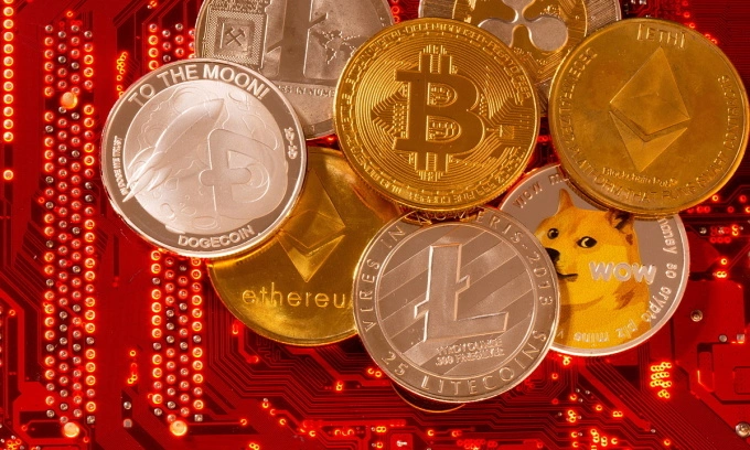 Representations of cryptocurrencies Bitcoin, Ethereum, DogeCoin, Ripple, Litecoin are placed on PC motherboard in this illustration taken, Jun. 29, 2021. Photo by Reuters
