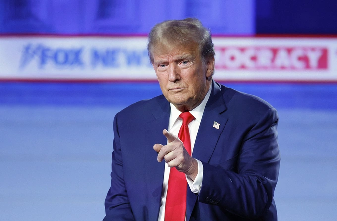 Former US President and 2024 Republican presidential hopeful Donald Trump gestures during a town hall in Des Moines, Iowa, on January 10, 2024. Photo by AFP