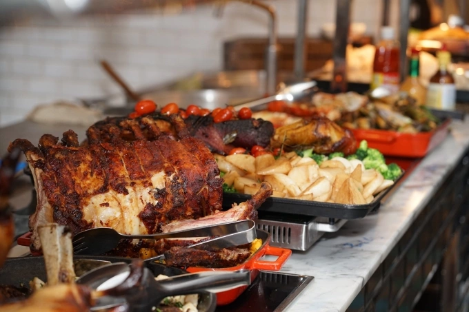 Roasted meat and potatoes are maintained hot at the Sunday roast buffet. Photo courtesy of Renaissance Riverside Hotel Saigon