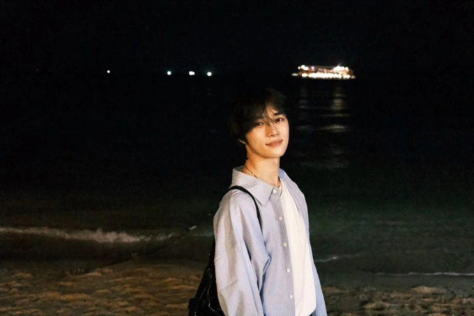 Beomgyu of K-pop boy band Tomorrow X Together on a beach in Phu Quoc at night. Photo courtesy of Beomgyu