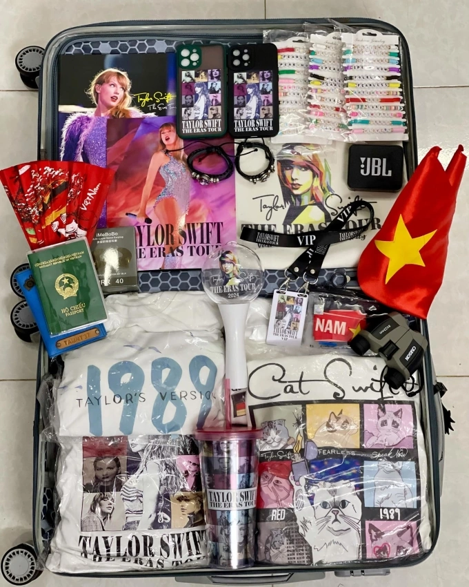 Tam Nguyens suitcase for his journey to Singapore is packed with Taylor Swift-related merchandise. Photo courtesy of Tam Nguyen