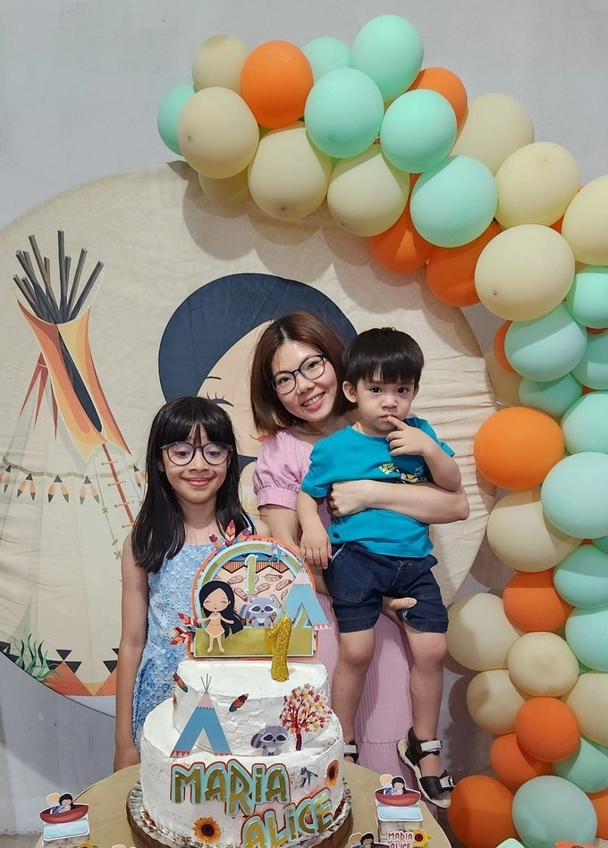 Hong (C), her son with Lazaro (far R), and Lazaro’s daughter Angelina from a previous relationship, at a family birthday celebration in 2022. Photo courtesy of Hong