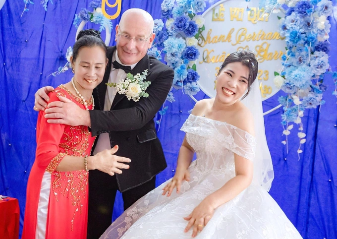 Le Garrec hugs his mother-in-law at his wedding in April 2023. Photo courtesy of Xuan