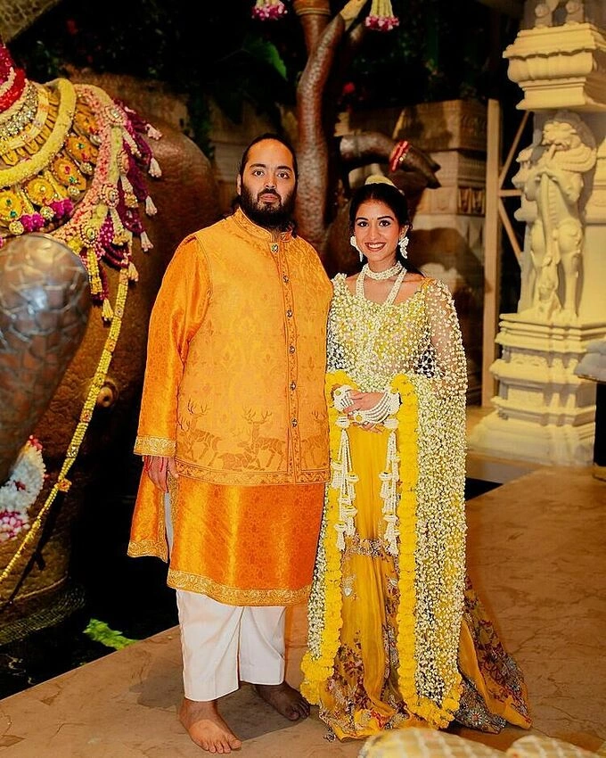 Anant Ambani (L), son of Indian billionaire Mukesh Ambani, and his wife Radhika Merchant. Photo from Instagram/loveleen_makeupandhair