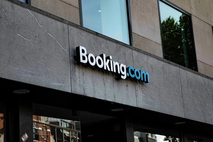 Travel agency Booking.coms logo seen on a building. Illustration photo by Pixabay