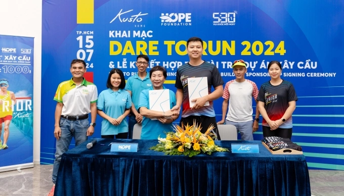 Bridge building sponsorship signing ceremony between Kusto Home and Hope Foundation. Photo courtesy of ???