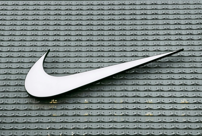 A Nike logo seen on a building. Illustration photo by Unsplash
