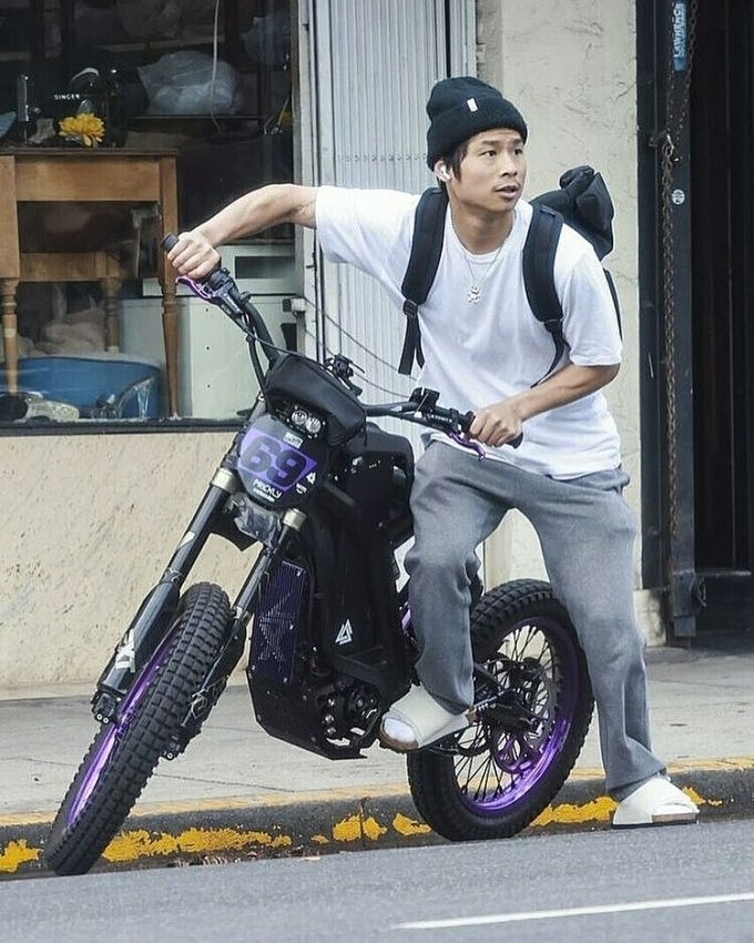 Pax Thien Jolie-Pitt, the Vietnamese-born adopted son of American actors Angelina Jolie and Brad Pitt, seen riding an electrical bike as he leaves a tobacco shop. Photo from Instagram/paxalbum