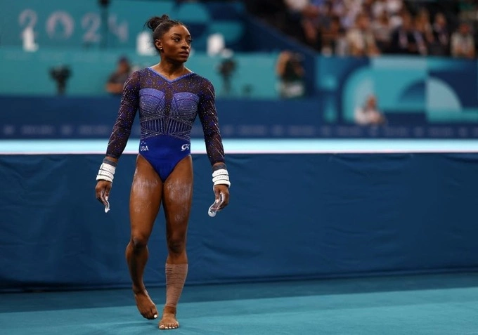Simone Biles in a blue bodysuit when competing at the Paris Olympics on August 1, 2024. Photo by Reuters