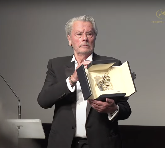 French actor Alain Delon poses with the Honorary Palme dOr he was awarded during the 72nd edition of the Cannes Film Festival in Cannes, southern France, on May 19, 2019. Photo from Festival de Cannes YouTube