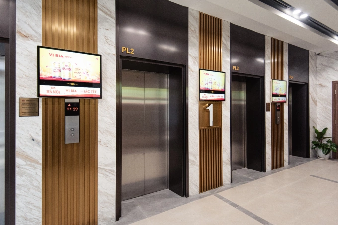 An elevator lobby installed with Chicilon Media advertising screens. Photo courtesy of Chicilon Media