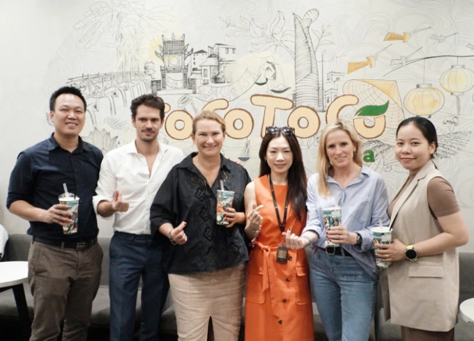 Representatives from ToCoToCo and Bel Vietnam celebrate their collaboration. Photo courtesy of ToCoToCo