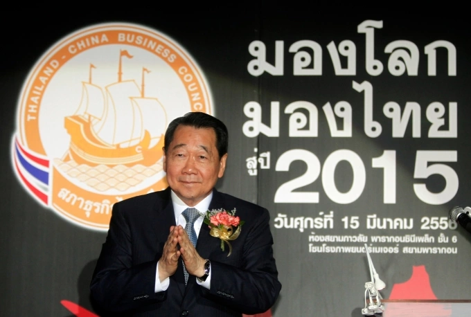 Dhanin Chearavanont gestures upon arrival at a Thailand-China Business Council seminar in Bangkok March 15, 2013. Photo by Reuters