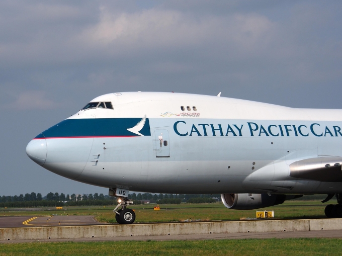 A Cathay Pacific aircraft seen on a runway. Photo by Pixabay