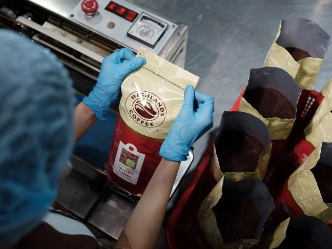 A worker packages ground coffee at a factory of Highlands Coffee. Photo courtesy of the company