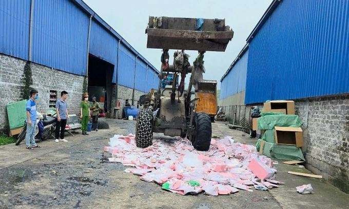 Baby Three dolls containing high level of formaldehyde are destroyed in Quang Ninh Province. Photo courtesy of Quang Ninh Police