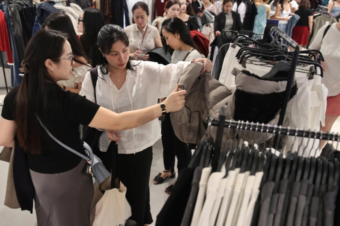Customers shop in a mall in Ho Chi Minh City