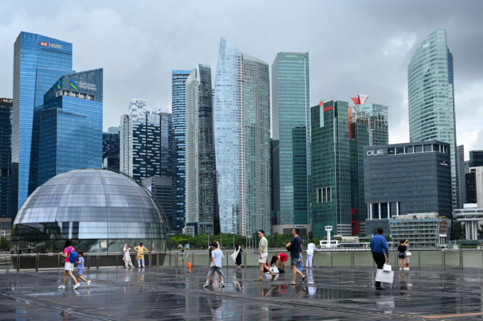 People gather on the boardwalk at Marina Bay in Singapore on January 9, 2024. Photo by AFP