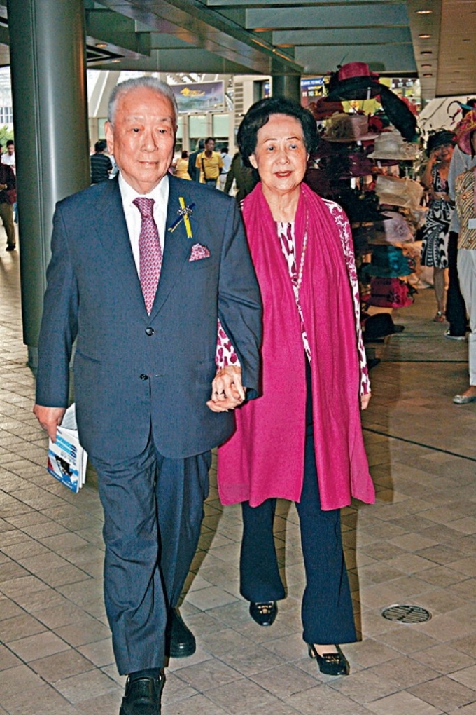 Hui Sai Fun, left, Chairman of Central Development Limited, and his wife are pictured in Hong Kong, China, Oct. 4, 2009. Photo by Imaginechina via AFP