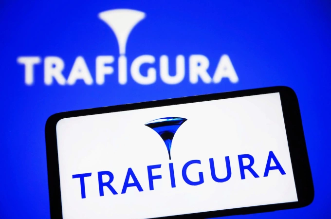 In this photo illustration, a Trafigura Group Pte. Ltd. logo is seen on a smartphone and on a pc screen. Photo by Reuters
