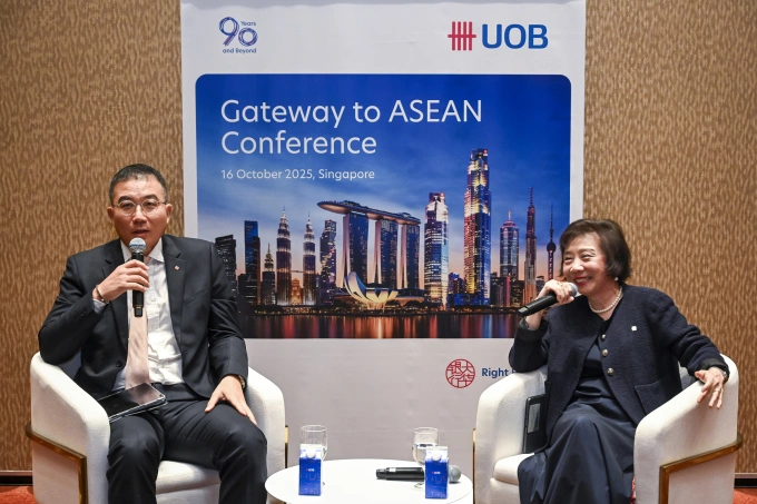 Don Kim (L), Chief International Business Officer at Lotte Shopping Holdings, and So Lay Hua, Head of Group Transaction Banking, UOB, speak to the press. Photo courtesy of UOB