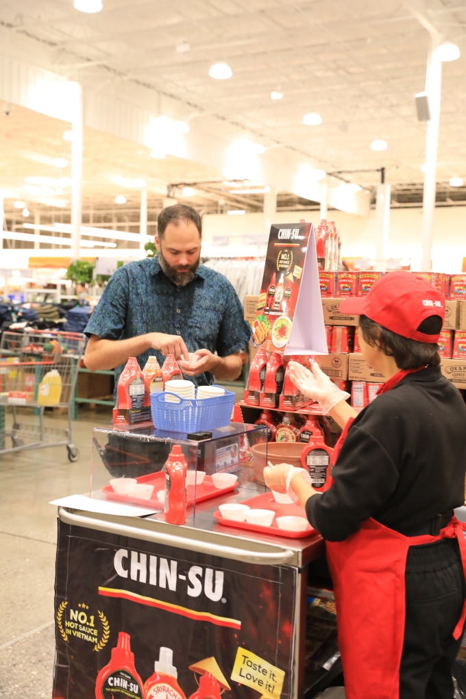 Customers sampling Chin-su chili sauce at Costco U.S. Photo courtesy of Masan Consumer
