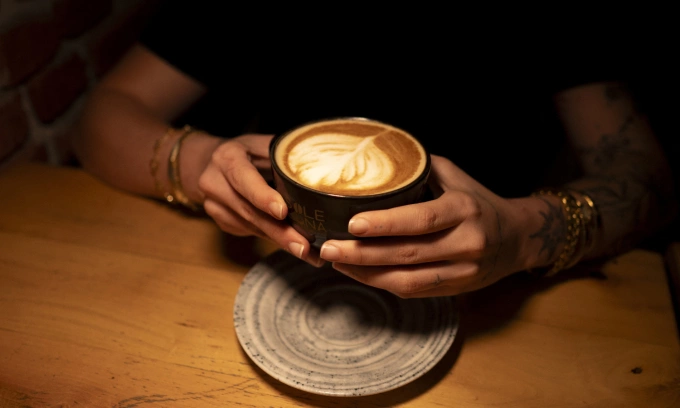 A cup of latte topped with latte art is seen ahead of the International Coffee Day in Ankara, Turkiye, September 30, 2025. Photo by Anadolu via AFP